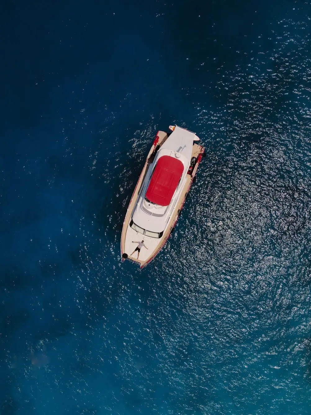 aerial shot of man who is on a luxury yacht at the ionian sea near corfu