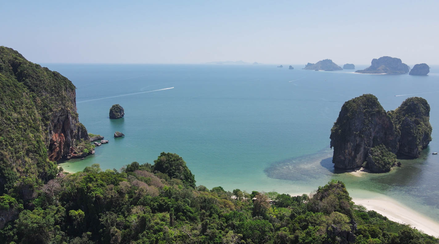 Limestone cliffs rising above the Andaman Sea in Krabi, Thailand