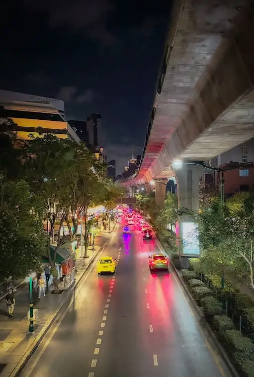 neon lights reflection on the streets of bangkok