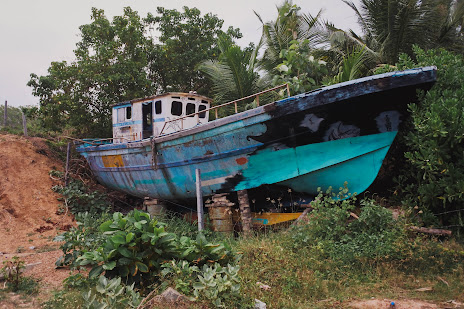 forgotten vibrant fishing boat in sri lanka