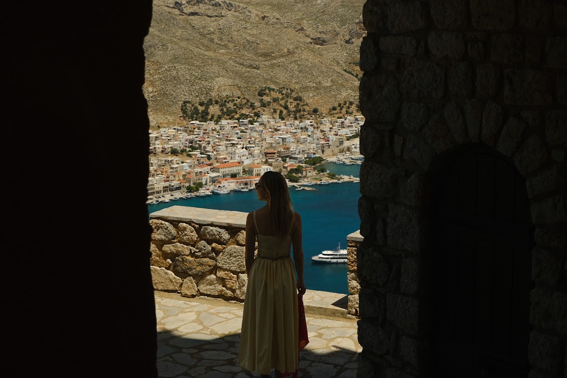 a woman looking from above the port of kalymnos island