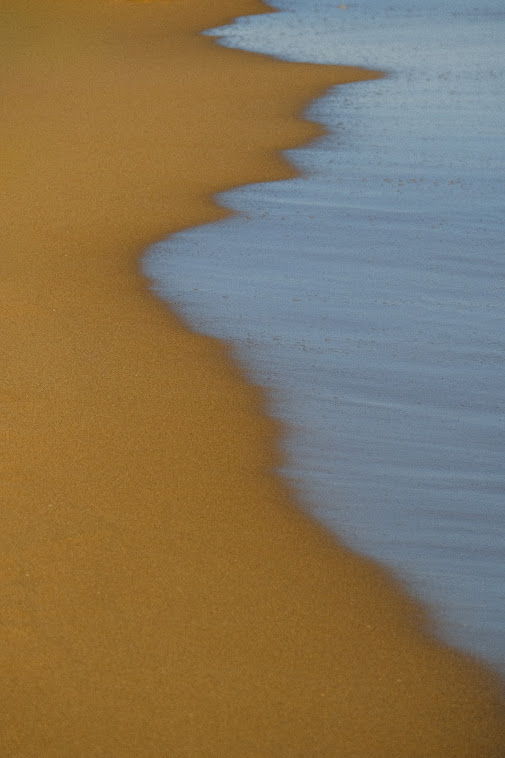 where the sea kisses the sand